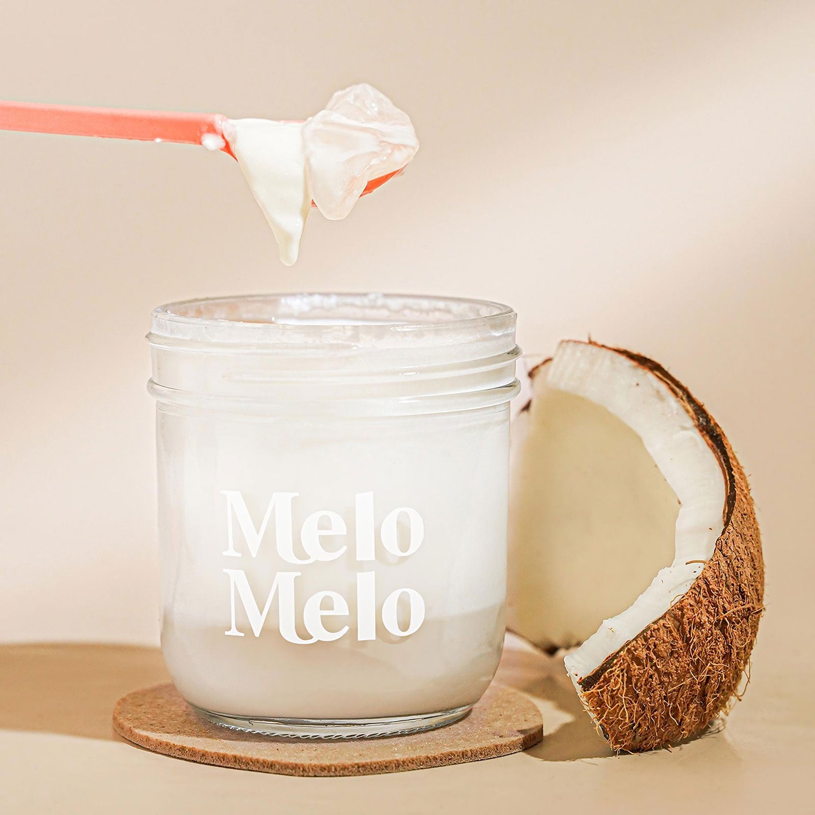layered coconut jelly, two layers, clear glass cup, bottom transparent coconut water jelly, top creamy milk jelly, smooth glossy texture, clean background, soft natural light, premium food photography
