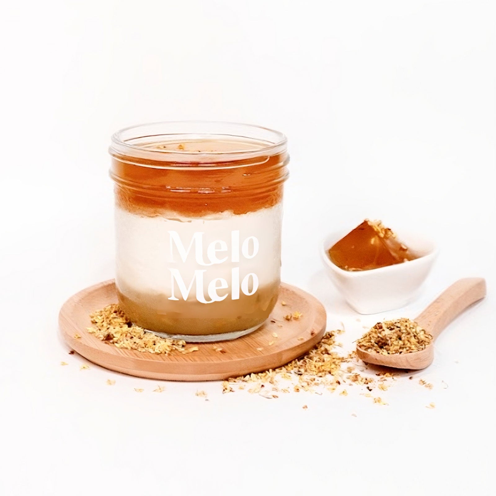 Osmanthus Oolong OAT coconut jelly in glass jar, creamy coconut layer with oolong tea, the richness of osmanthus, and the denseness of oats base and layer, spoon lifting silky jelly, dripping texture, oamanthys oolong jelly and oats beside, clean beige background, soft natural light, premium food photography