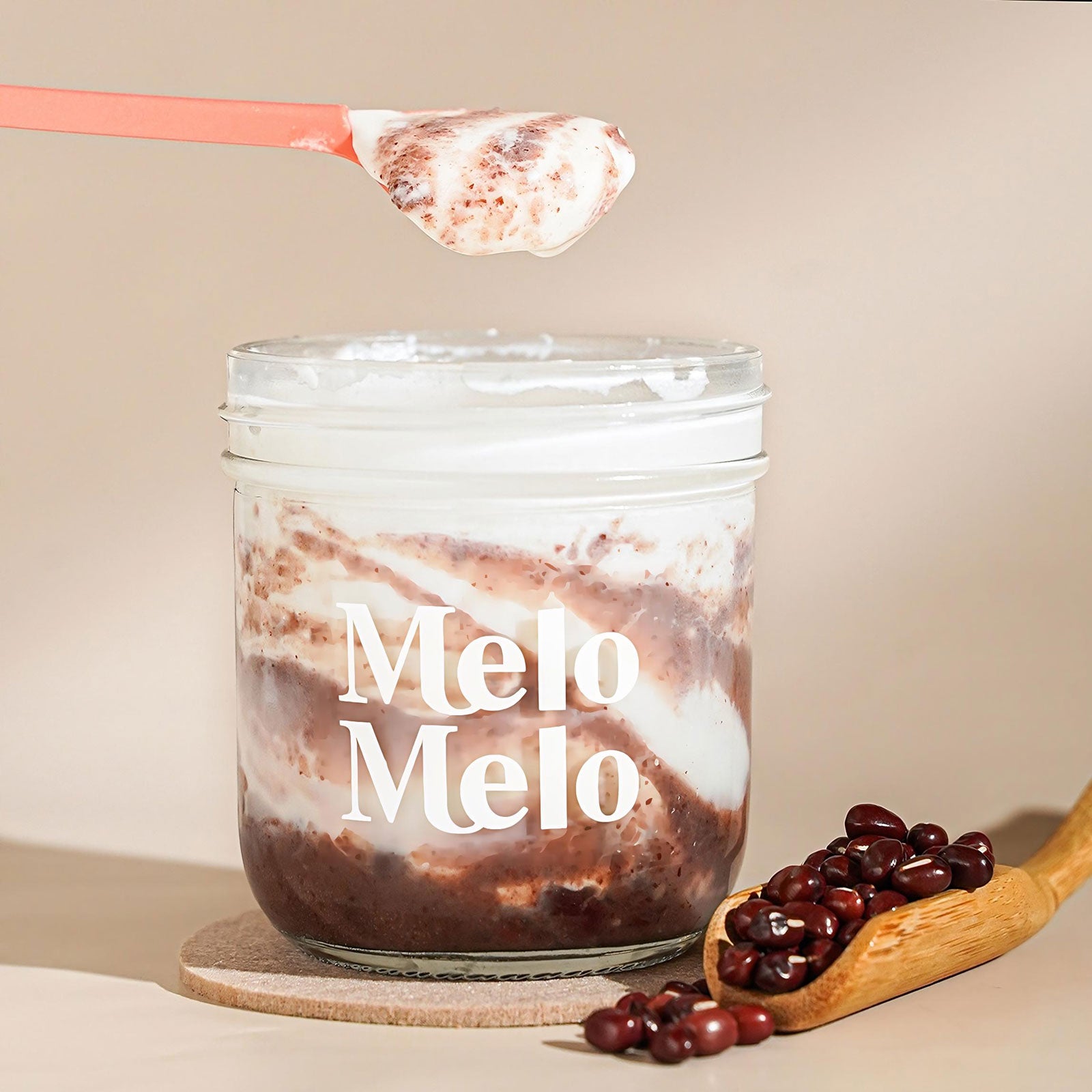 Red Bean coconut jelly in glass jar, creamy coconut layer with chunky sweet red bean and red bean paste  base, spoon lifting silky jelly, dripping texture, fresh red bean beside, clean beige background, soft natural light, premium food photography